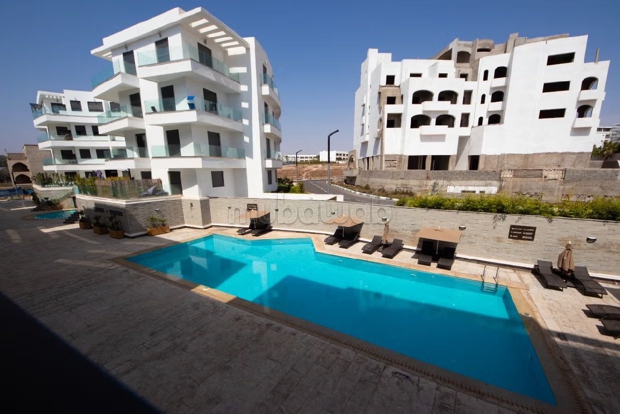 Appartement à louer courte durée à Agadir bay secteur touristique 
deux chambre salon cuisine équipée superficie 75 mètres carrés piscine à 300 mètres de la plage - Photo 2